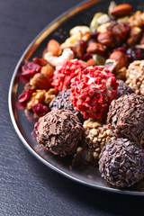 Homemade candy with chocolate , nuts and dried strawberry