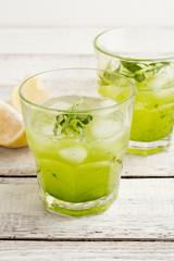 cocktail with ice in a glass on a white background
