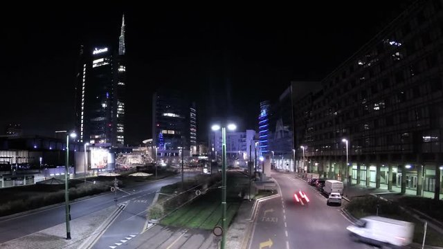 Rotating timelapse night video of downtown city traffic. Video shot in Milan, Italy
