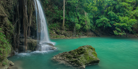 Naklejka na ściany i meble Beautiful and Breathtaking green waterfall, Erawan's waterfall