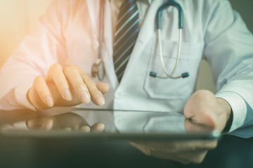 Unknown doctor using computer plane-table