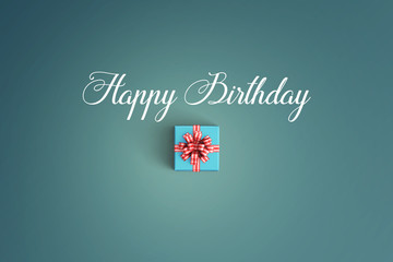 Happy birthday and gift box on color background