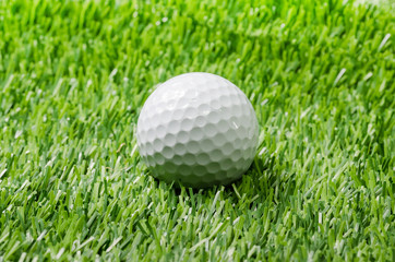 Golf ball on green grass.