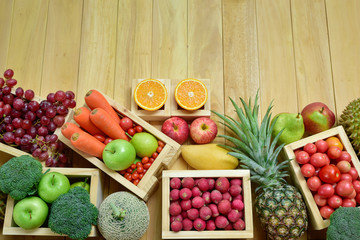 Variouse fresh fruits and vegetables in wooden container with copy space, Top view shooting image