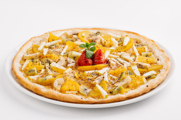Sweet pizza with fruits on table