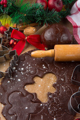 Gingerbread dough, cookie cutters and spices. Winter Christmas holiday time. Selective focus