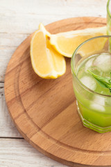 cocktail with tarragon and lemon in a glass