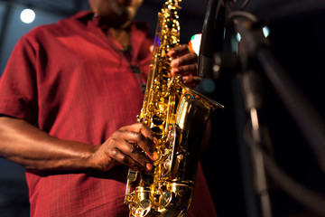 Obraz premium African American jazz musician playing the saxophone, closeup