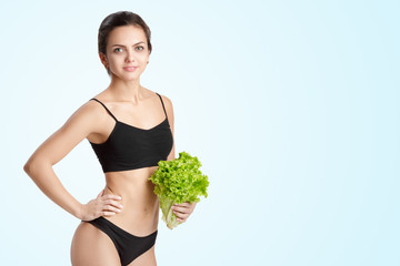 healthy woman with salad leaves