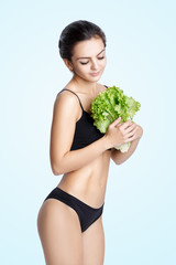 healthy woman with salad leaves