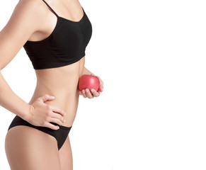 Beautiful young healthy woman with a red Apple. 