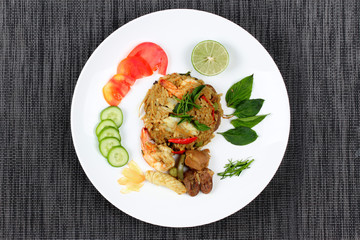 Fried jasmine rice in green curry with mixed meat.