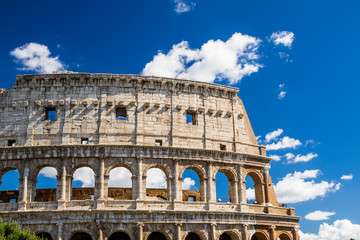 Colosseum with clear blue sky and clouds, Rome