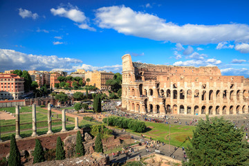 Colosseum with clear blue sky and clouds, Rome