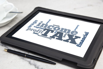tablet with tax word cloud