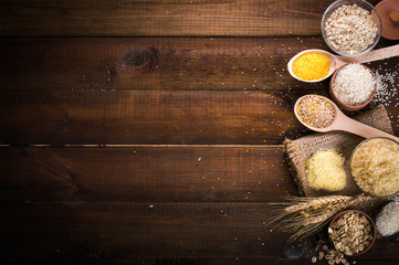 Cereals on wooden background. Space for text