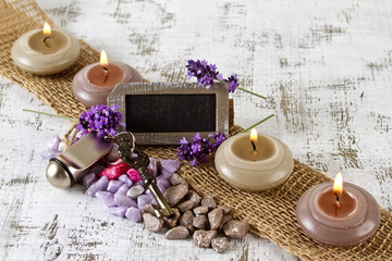 Obraz na płótnie Canvas wellness Travel concept with hotel key lavender and candles