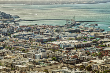 Fototapeta premium Aerial view of San Francisco skyline. Panorama of the Fisherman's Wharf, Pier 39 and North Beach from top of Coit Tower, California, United States.