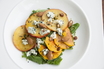 Caramelised apple salad and blue cheese with roasted almonds on top. For vegan and it's gluten free.