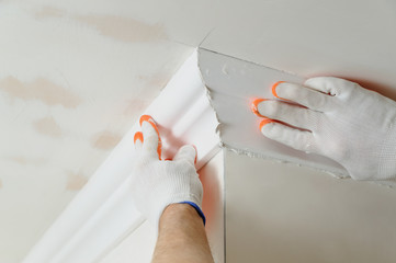 Installation of ceiling moldings.