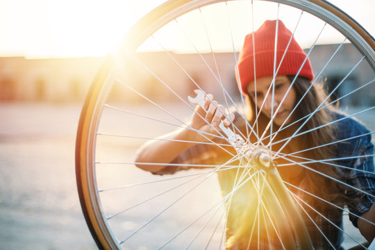 Young girl repair bicycle