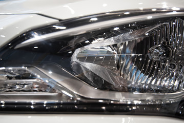 Obraz premium Close-up headlights of car
