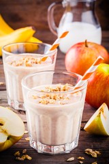 Healthy breakfast: smoothie with granola, red apple and banana