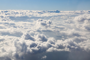 look of the clouds through the window of an airplane