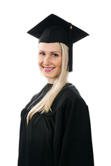 happy smiling college graduate wearing gown on white