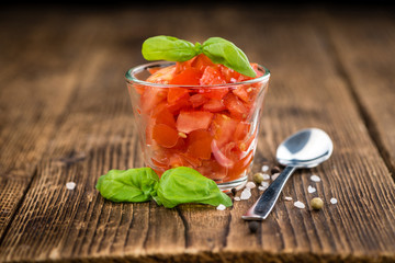 Cutted Tomatoes on vintage wooden background
