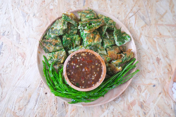 Fried acacia pennata omelet or cha-om eggs with chili paste