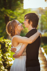 Fototapeta premium guy and the girl embracing on a background of park