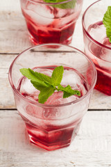Red juice with ice and mint