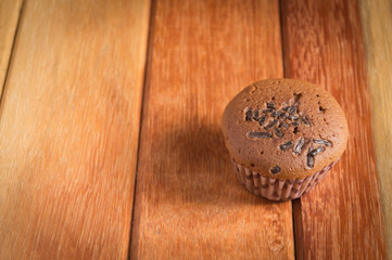 Cup cake on wood background.Tone.Selective focus.
