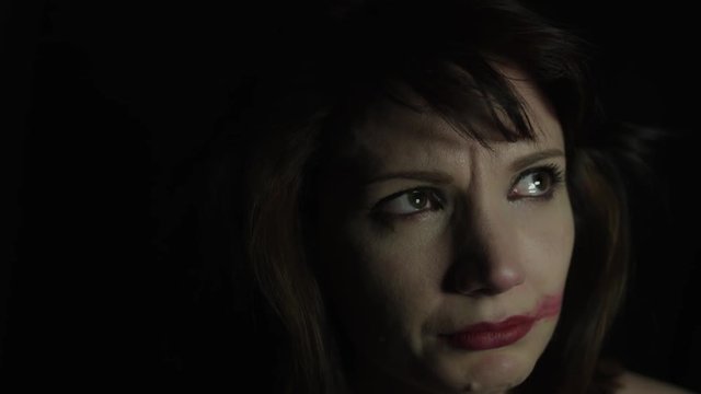 4k shoot of a woman in studio crying and acting