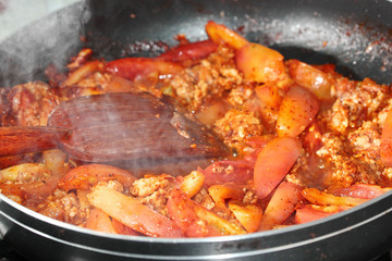 Cooking spicy meat and tomato dip. Selective focus