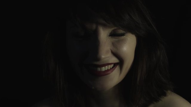 4k shoot of a woman in studio smiling cheerful