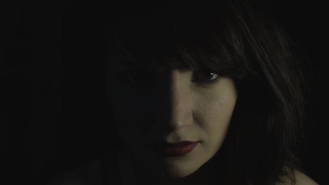 4k shoot of a woman in studio smiling cheerful