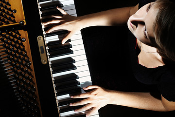 Pianist playing grand piano player