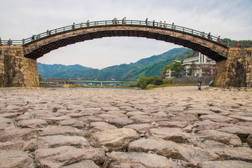 Kintai wooden arch bridge, Iwakuni, Japan  (with tourist on the bridge)