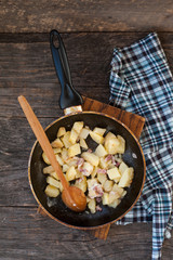 Fried potatoes with bacon