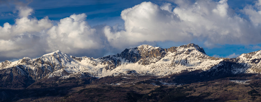 Snow covered Piolit and Parias mountain peaks. Winter in Hautes Alpes, Southern French Alps, France