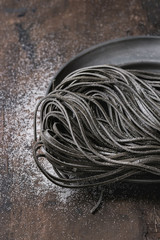 Raw black spaghetti pasta