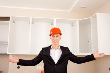 smiling civil engineer shows new apartment