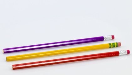 Three wooden sharp pencils isolated on white