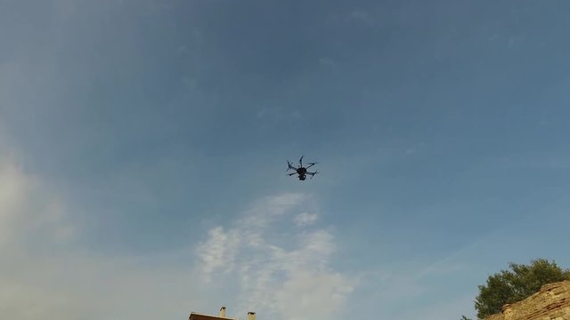 Drone flying with camera on sky