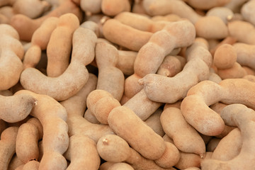 Group of ripe tamarind pods use for background