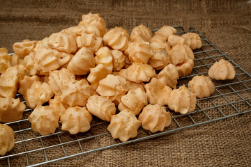 Choux cream in bakery tray on wood table