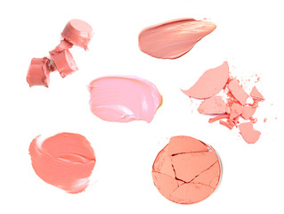 collection of various make up lipstick and powder strokes on white background