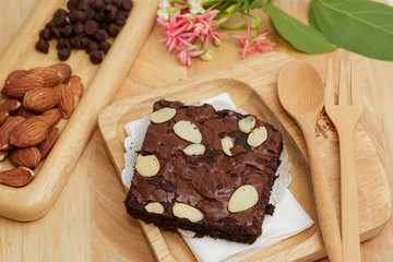 chocolate brownies on wooden plate ready to eat
